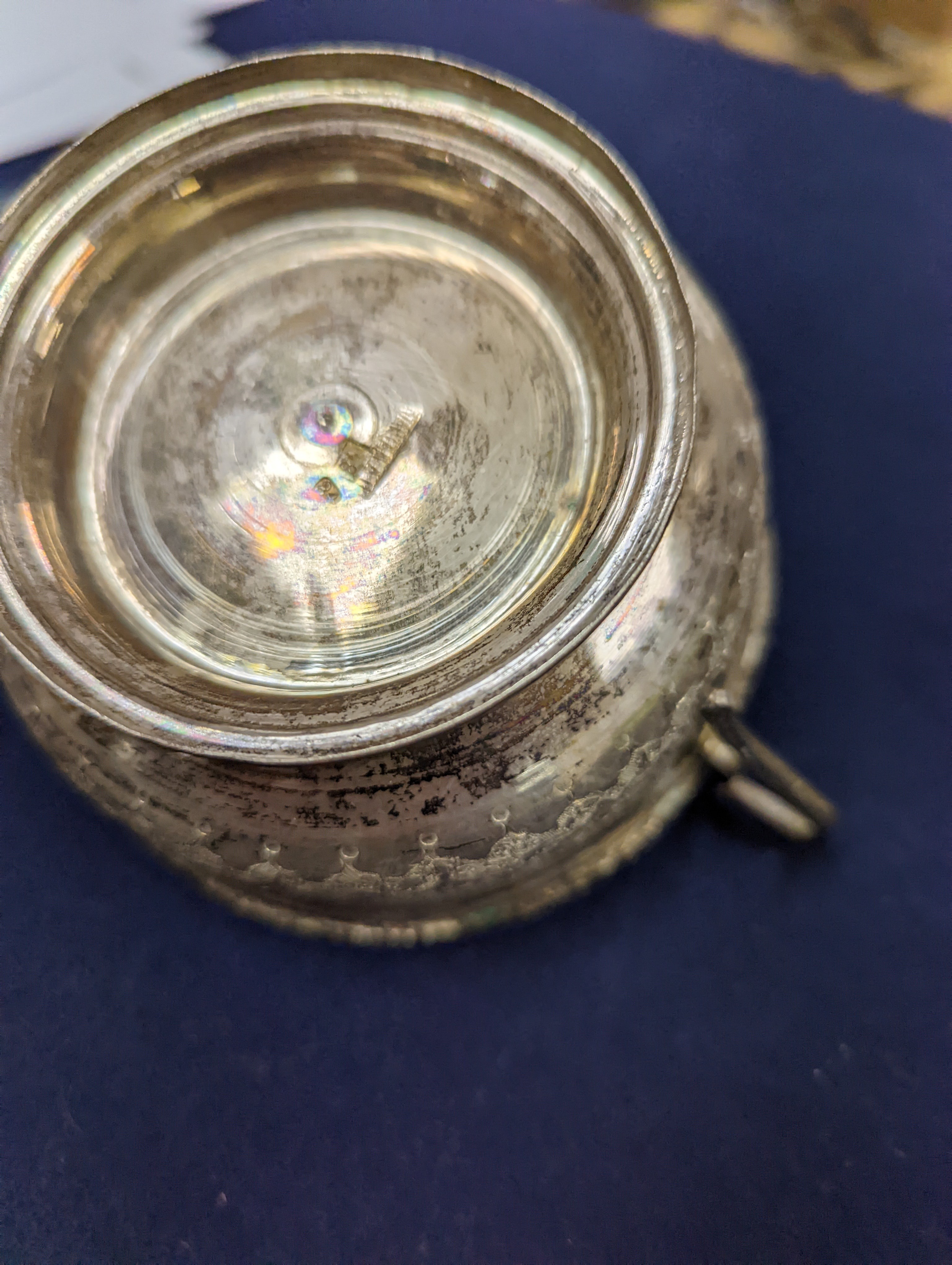 A set of six Persian embossed 84 standard white metal coffee cup holders and matching sugar bowl and cover by Vartan and four other Persian white metal items.